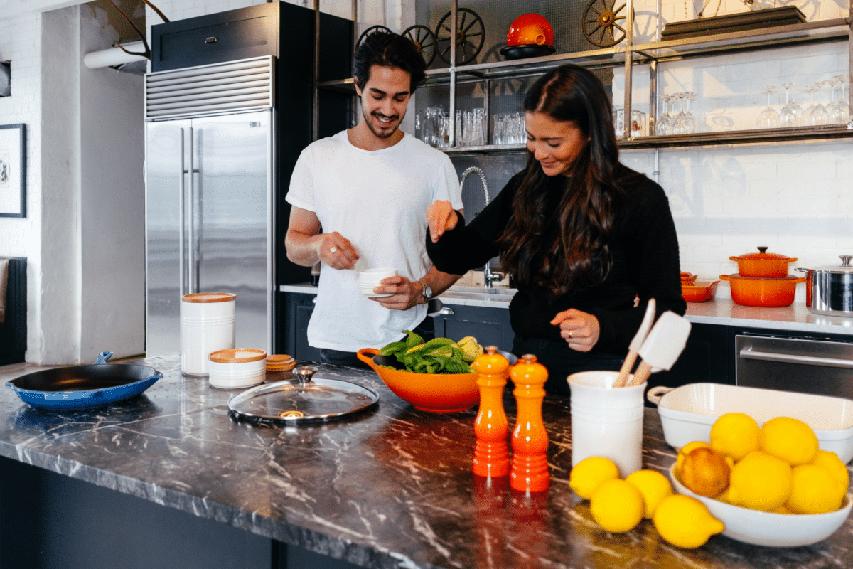 Couple cooking in kitchen