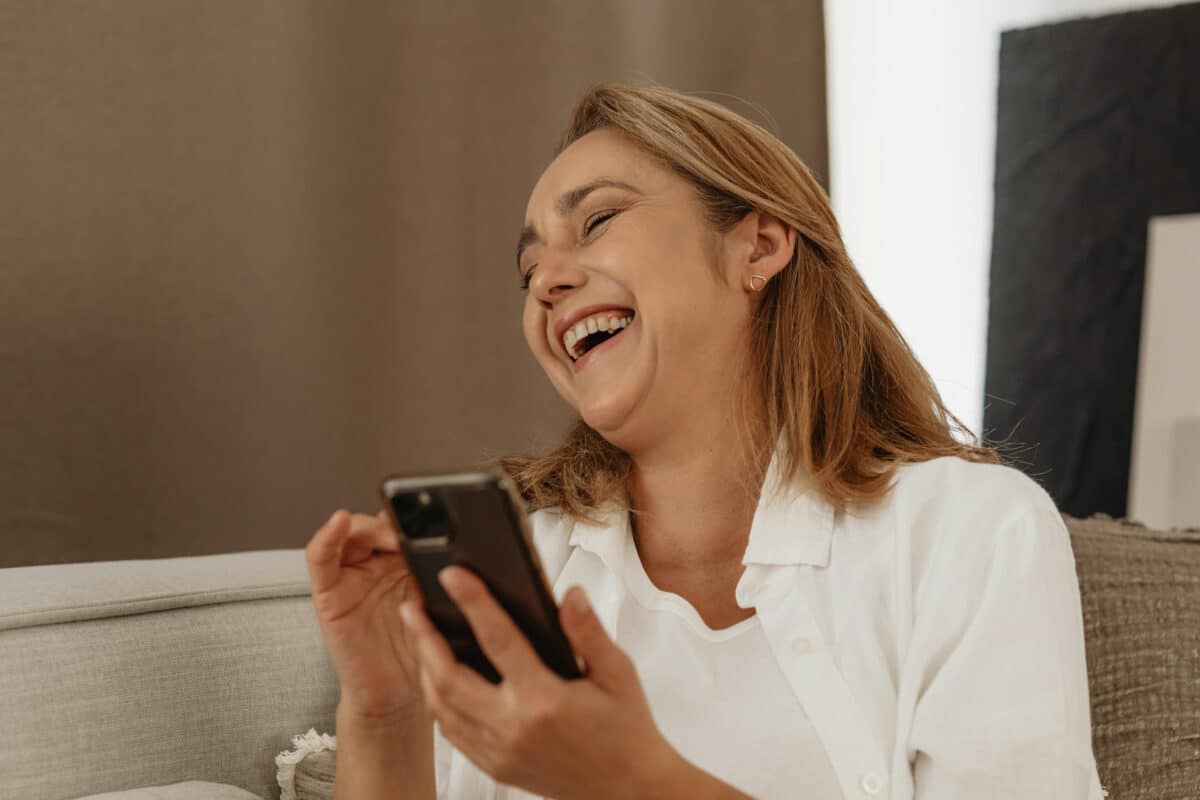 Woman on phone laughing