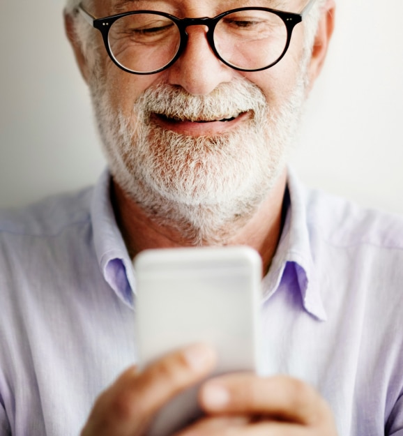 Man looking at phone smiling