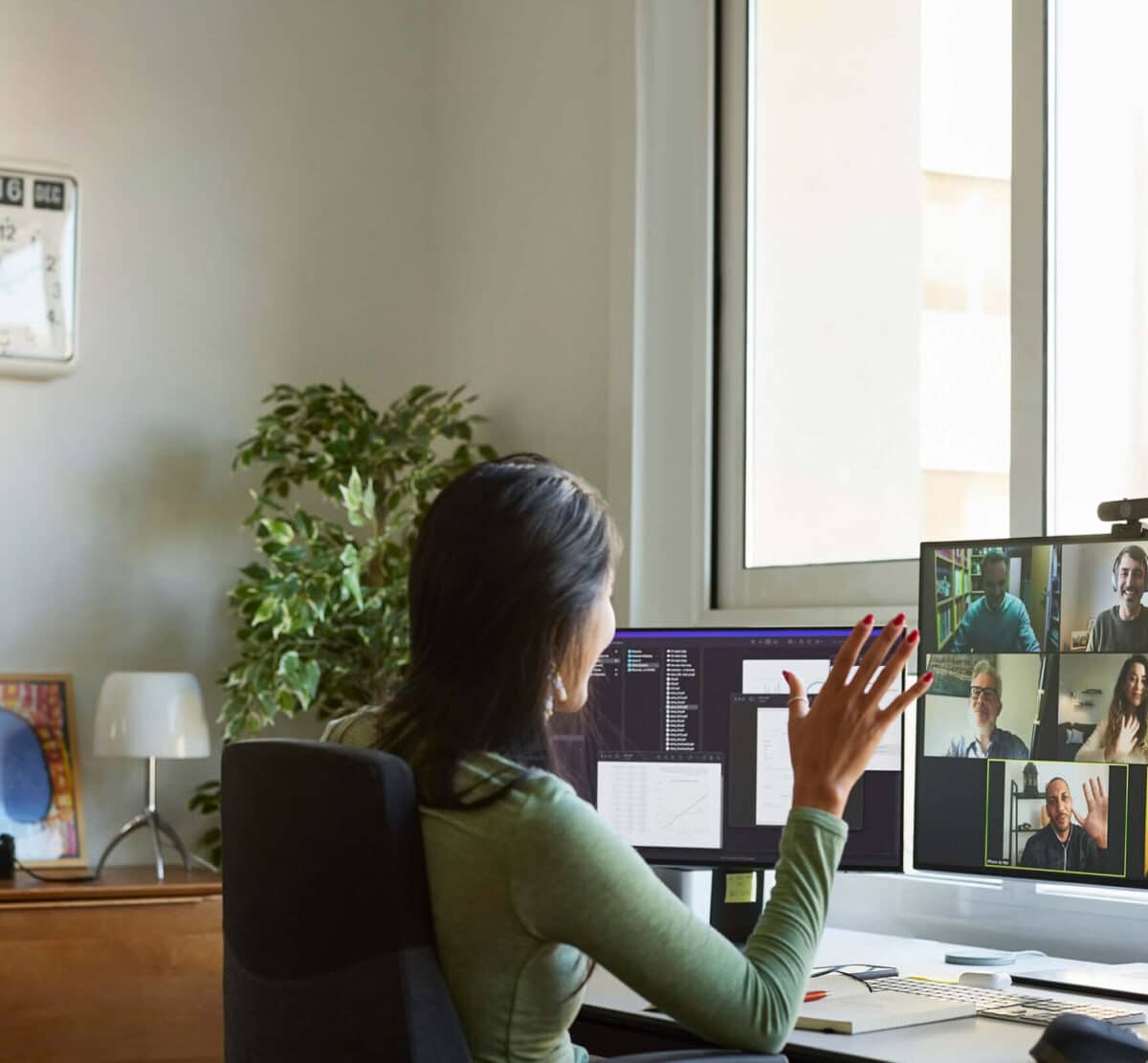 Woman on video call with co-workers