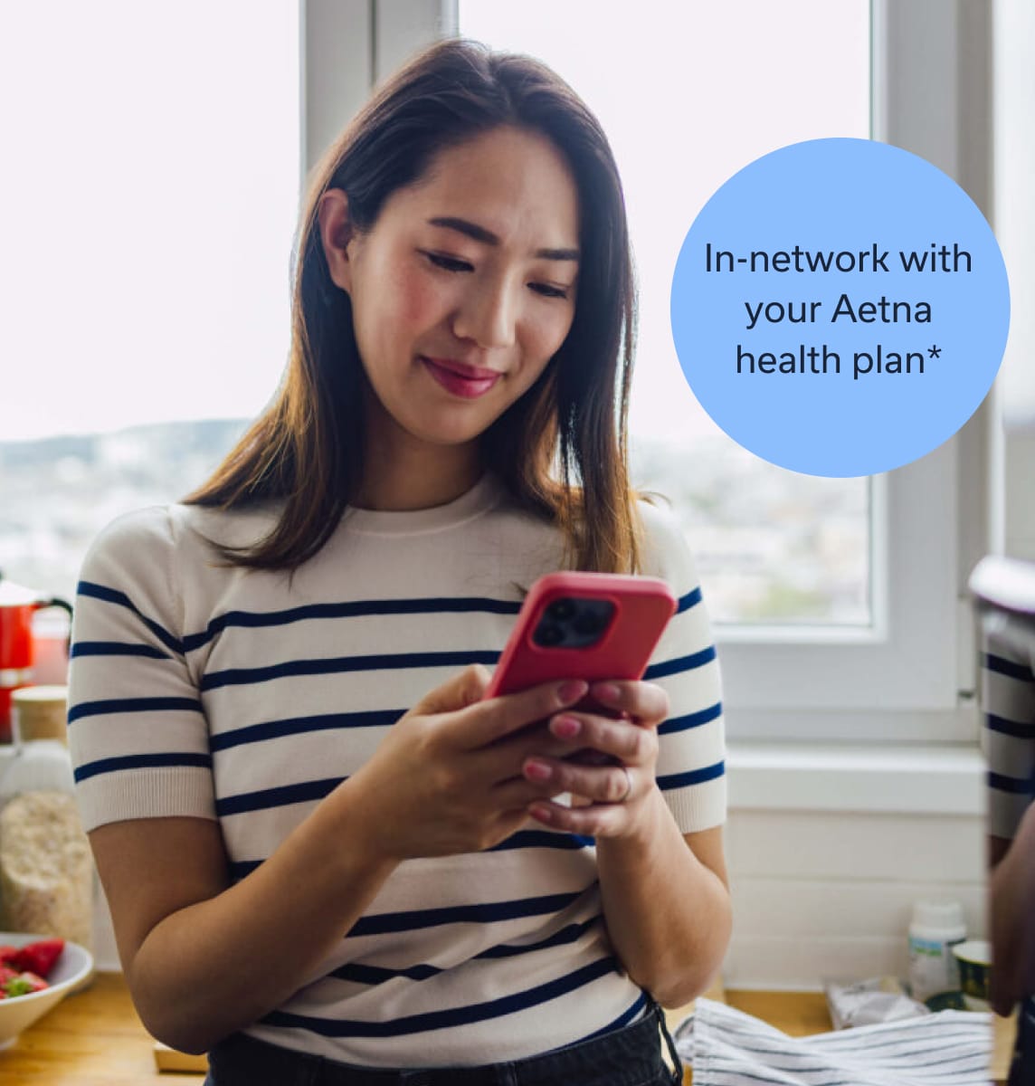 women booking telehealth visit on her iphone