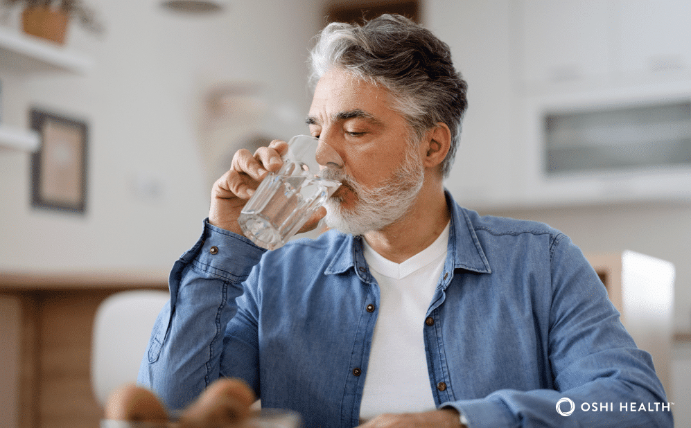 Man drinking a glass of water
