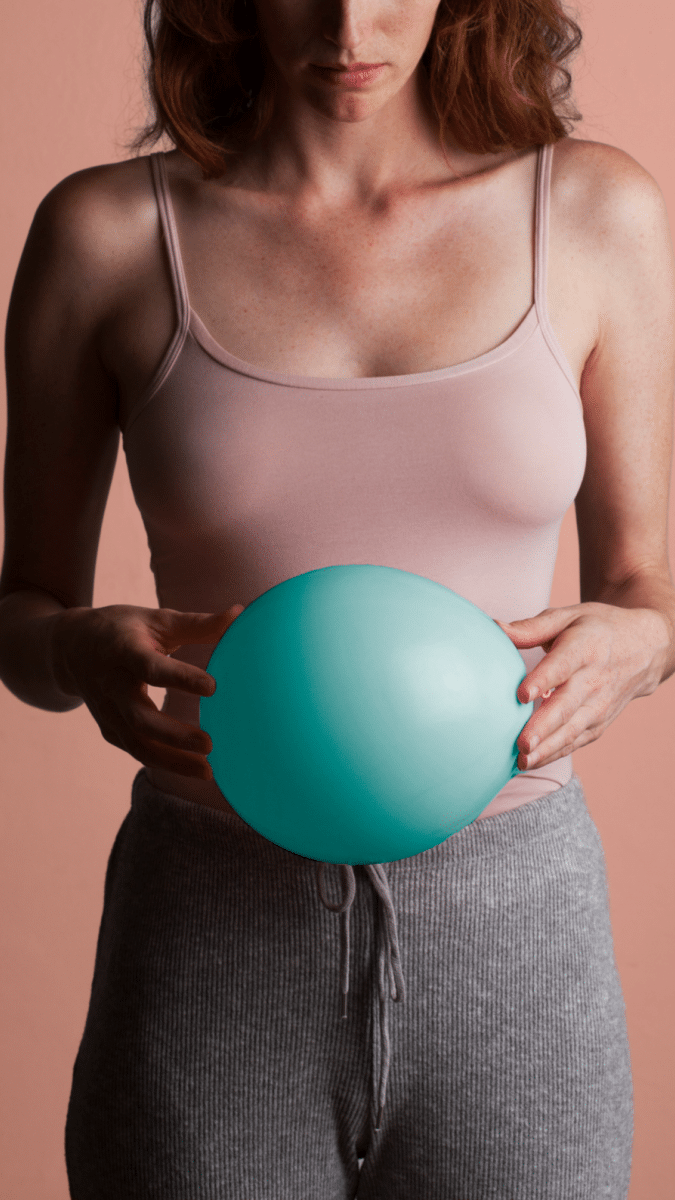 woman holding balloon
